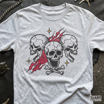 Three screaming skulls with burning red flames and crossbones tattoo flash clipart for Halloween t-shirts and apparel