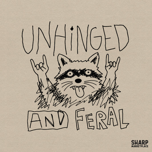 Hand-drawn sketchy raccoon illustration with rock hands and the text Unhinged and Feral, perfect for funny apparel or sticker sublimation.