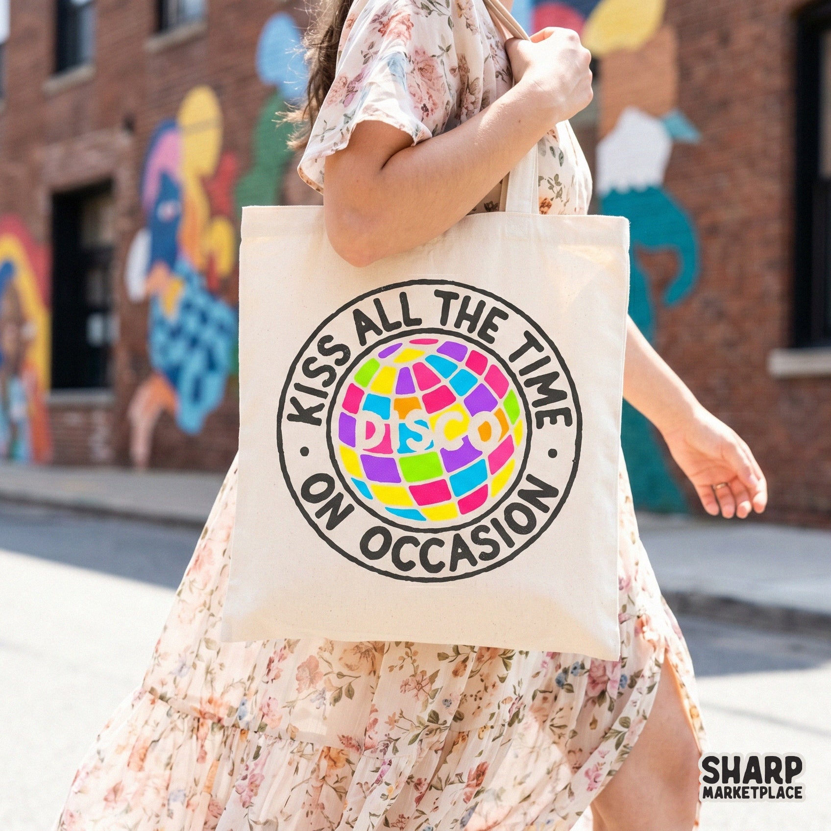 Digital sublimation graphic showcasing a colorful disco ball inside a circular frame with the playful quote Kiss All The Time On Occasion.
