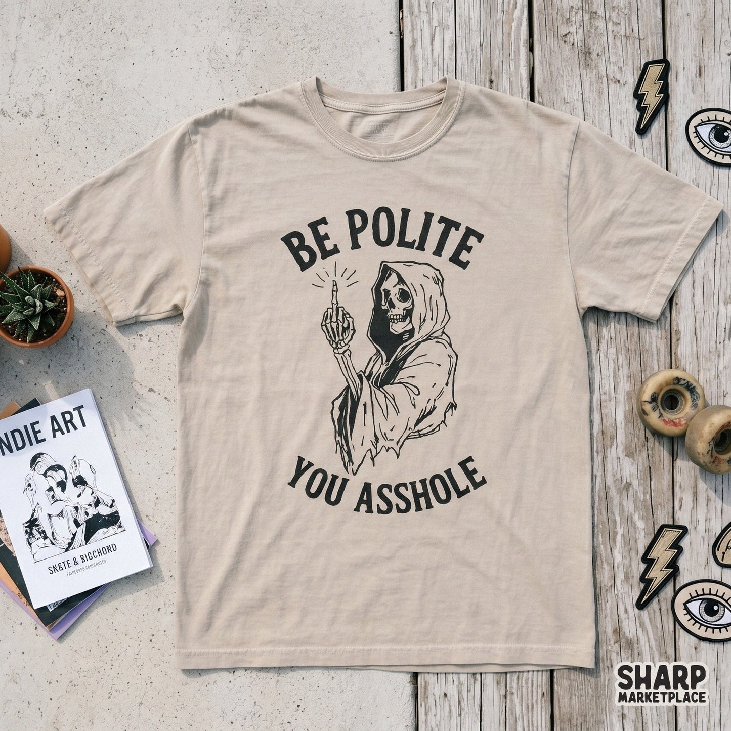 Retro style black and white skeleton reaper illustration with a middle finger gesture and bold vintage typography for Halloween apparel or stickers.
