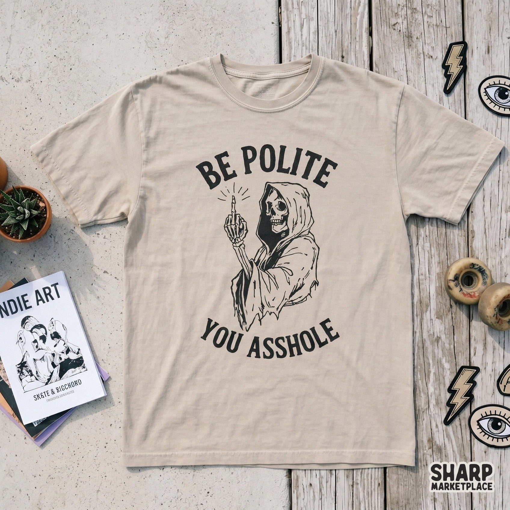 Retro style black and white skeleton reaper illustration with a middle finger gesture and bold vintage typography for Halloween apparel or stickers.