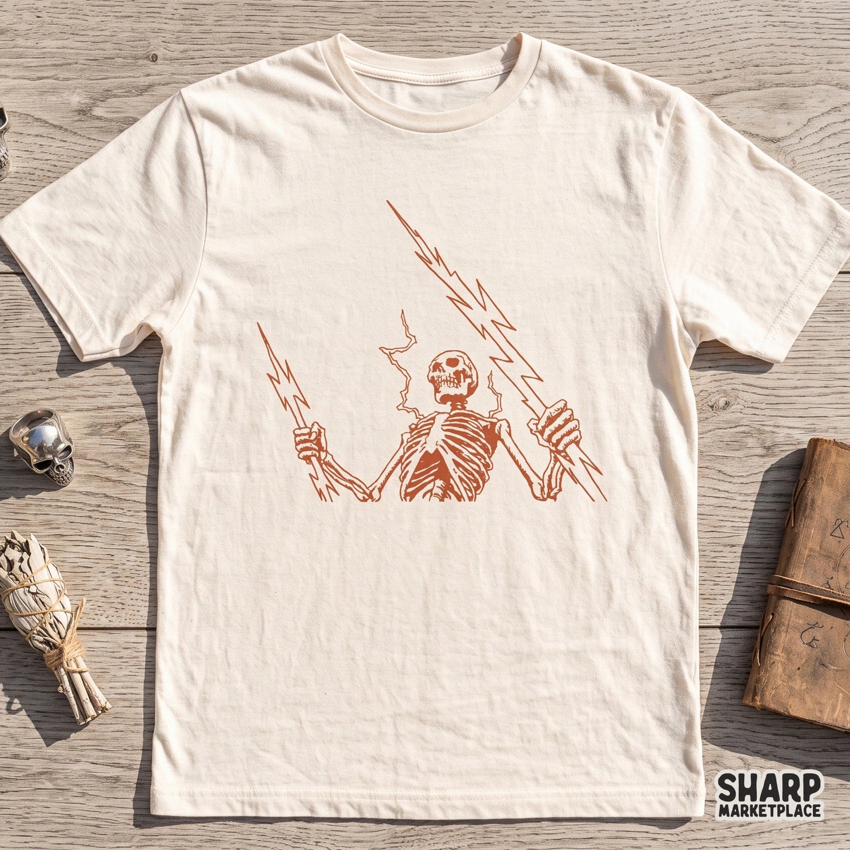 Electric skeleton holding lightning bolts in an edgy goth retro style for spooky season Halloween shirt sublimation designs