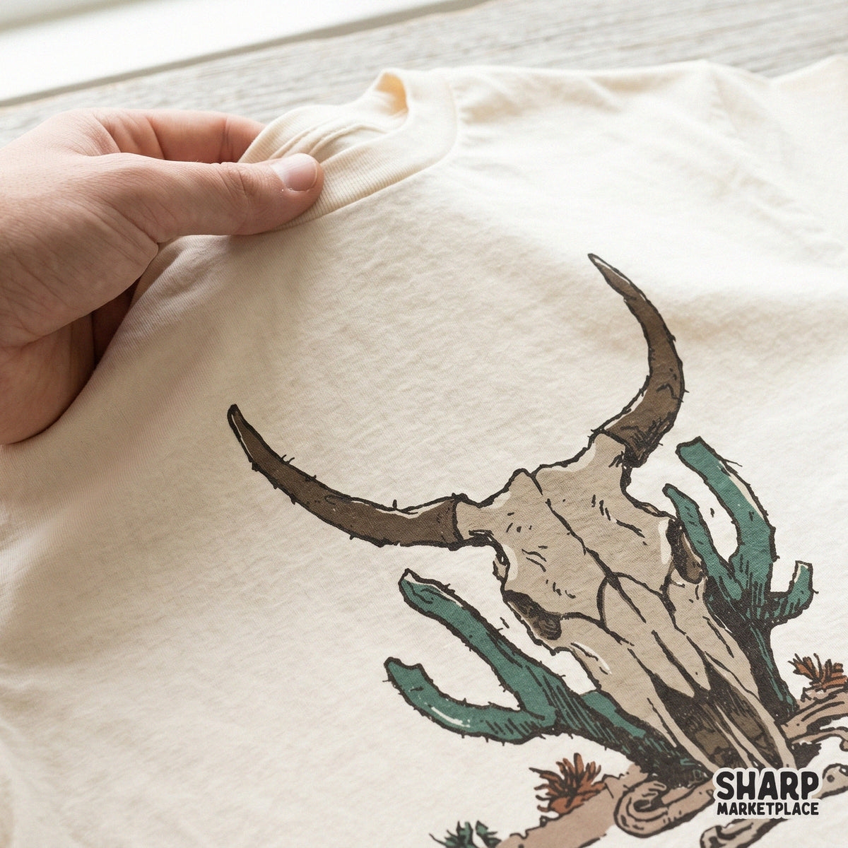Detailed desert bones illustration featuring a longhorn skull and green cactus, a versatile digital asset for western-inspired craft projects.