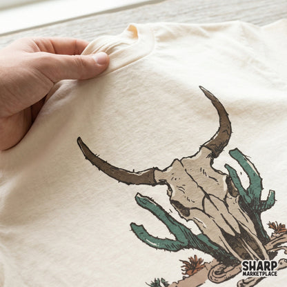 Detailed desert bones illustration featuring a longhorn skull and green cactus, a versatile digital asset for western-inspired craft projects.