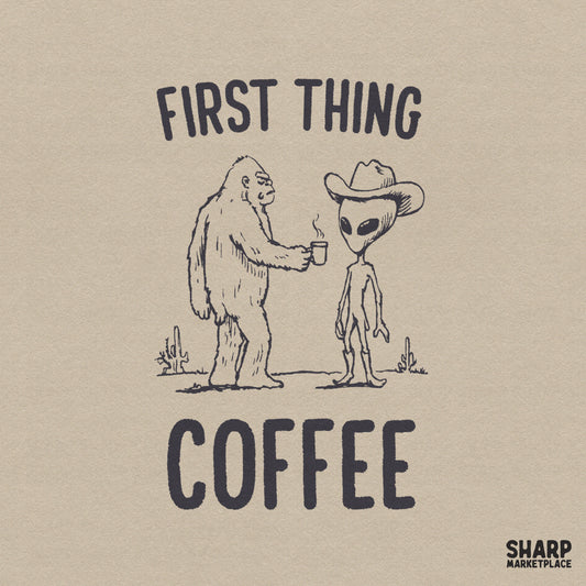 Hand-drawn sketch of a furry cryptid offering a steaming coffee mug to an alien wearing a cowboy hat and boots in a desert, with First Thing Coffee text.