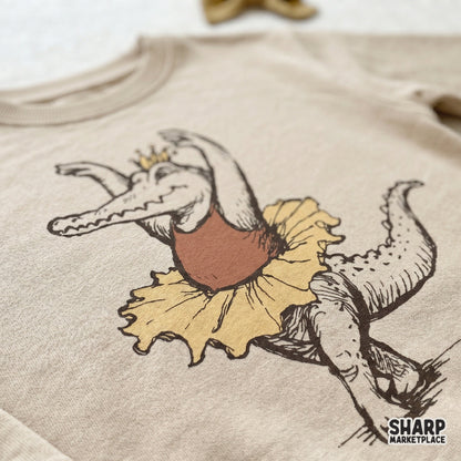 Whimsical dancing alligator in a ballet tutu and crown trendy retro png design for custom shirts and stickers