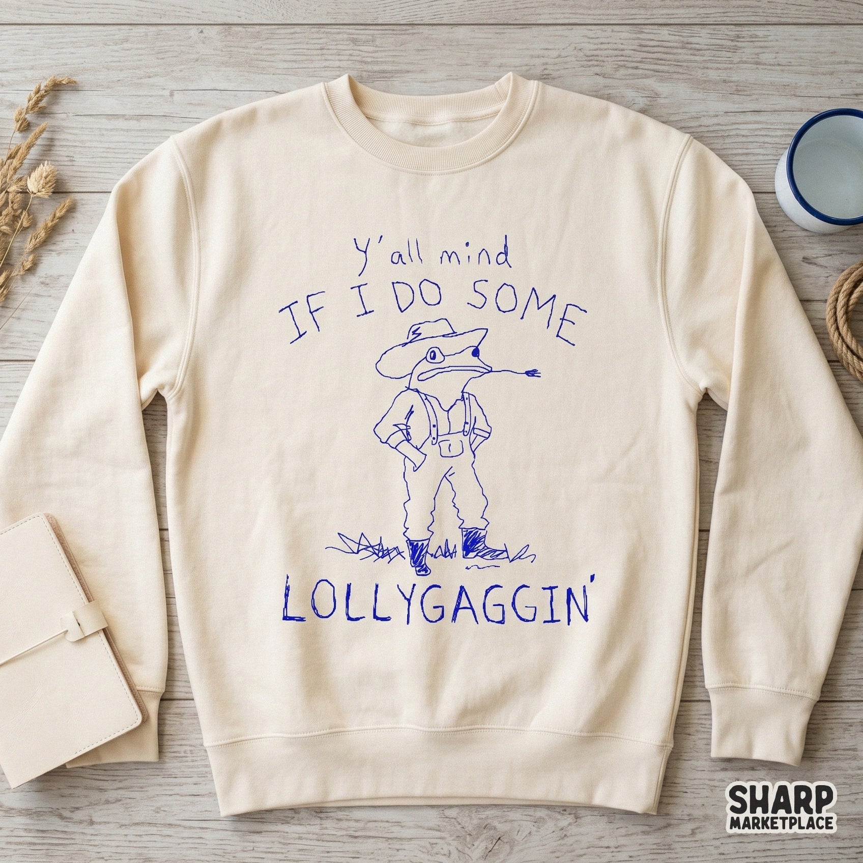 Minimalist blue line art design of a toad wearing a western hat and overalls, featuring the humorous phrase Y'all mind if I do some lollygaggin'.