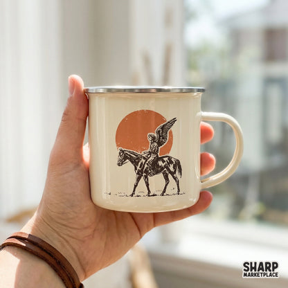 Western-themed digital download of a winged cowboy on a horse in front of a large sun, perfect for custom t-shirts, tumblers, and rustic wall art.