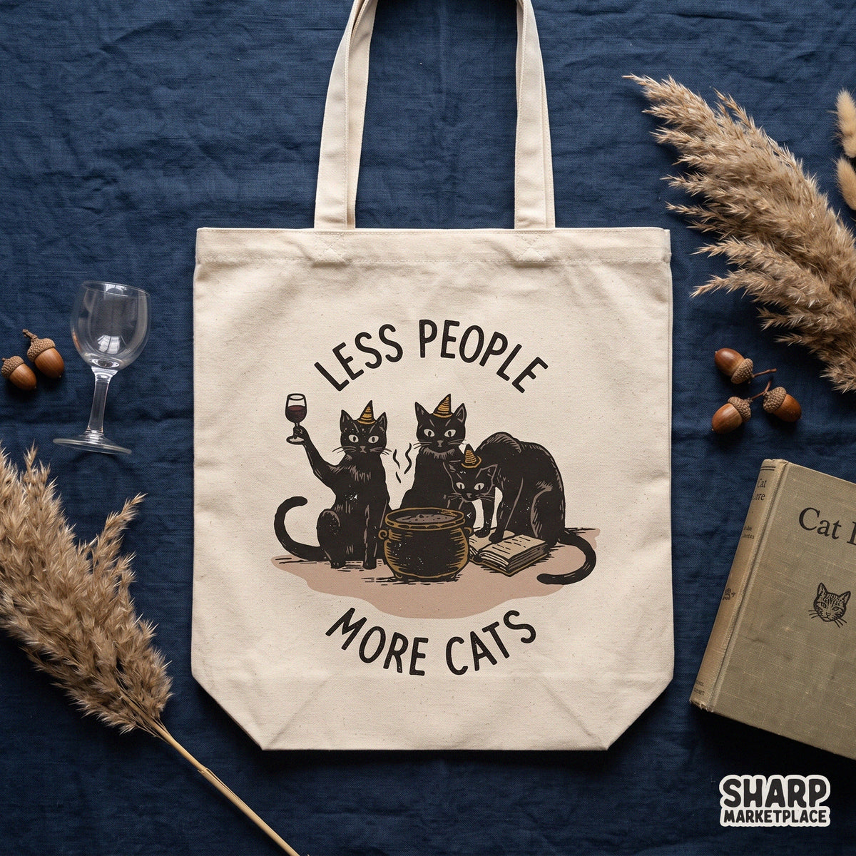 Funny witch cats brewing potion graphic with Less People More Cats phrase for spooky season Halloween t-shirts