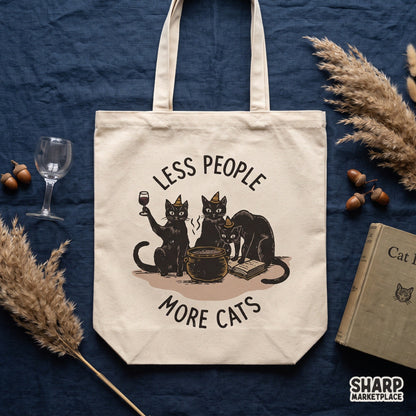 Funny witch cats brewing potion graphic with Less People More Cats phrase for spooky season Halloween t-shirts