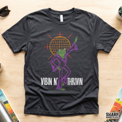 Retro disco ball frog shirt design featuring a dancing toad in a colorful 70s jumpsuit for t-shirt sublimation