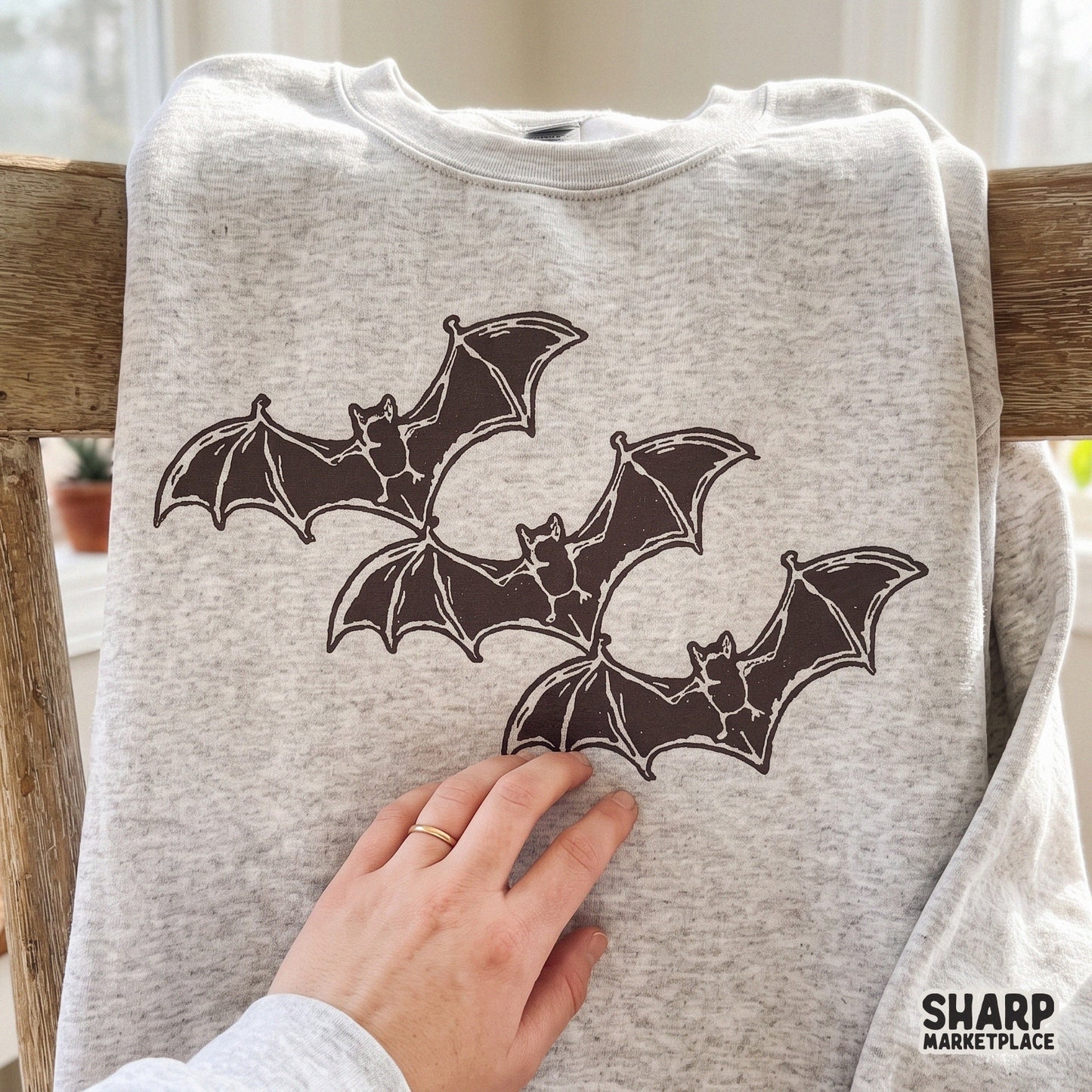 Three flying bats vintage block print illustration for spooky season sublimation and retro halloween shirts
