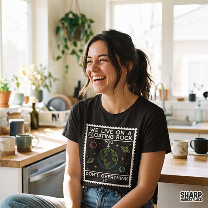 Sarcastic space planet PNG stamp graphic with We Live On A Floating Rock quote for t-shirt sublimation