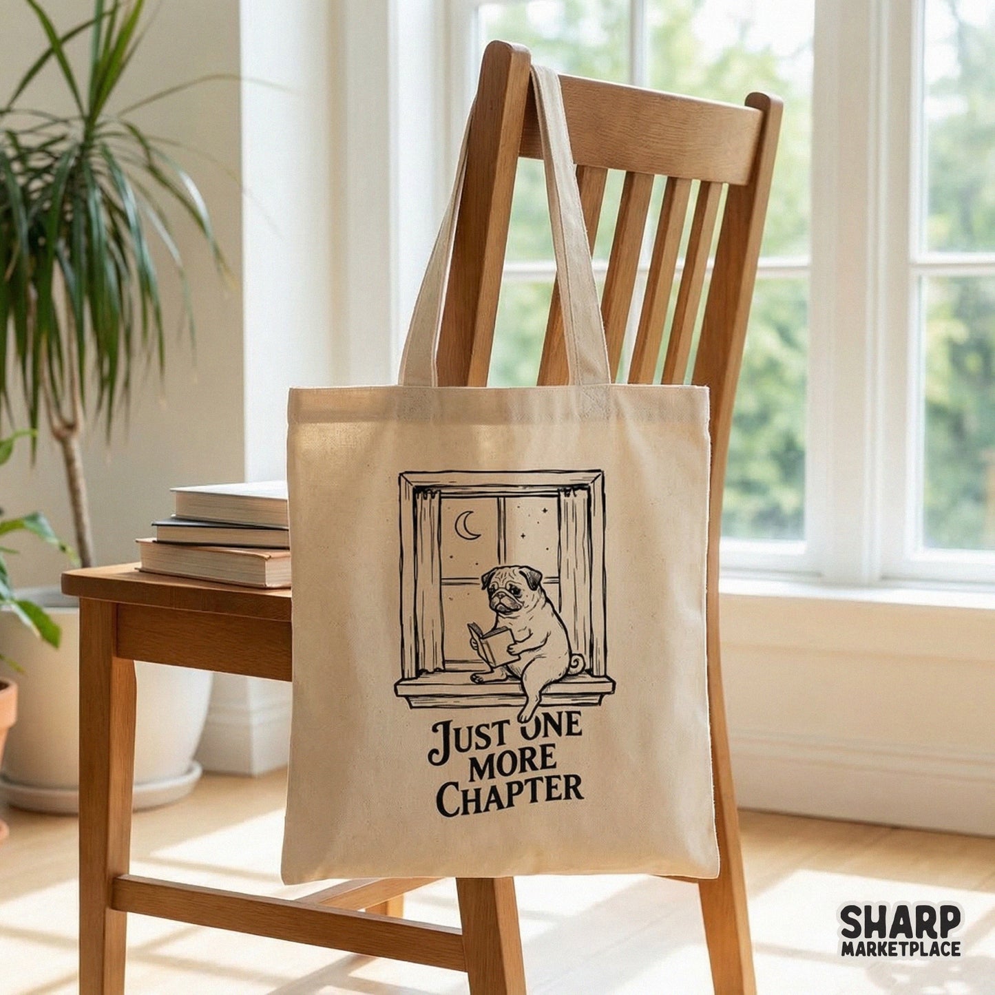 Cozy book lover graphic with a pug reading in a window at night, featuring the text Just One More Chapter for use on shirts, mugs, and tote bags.