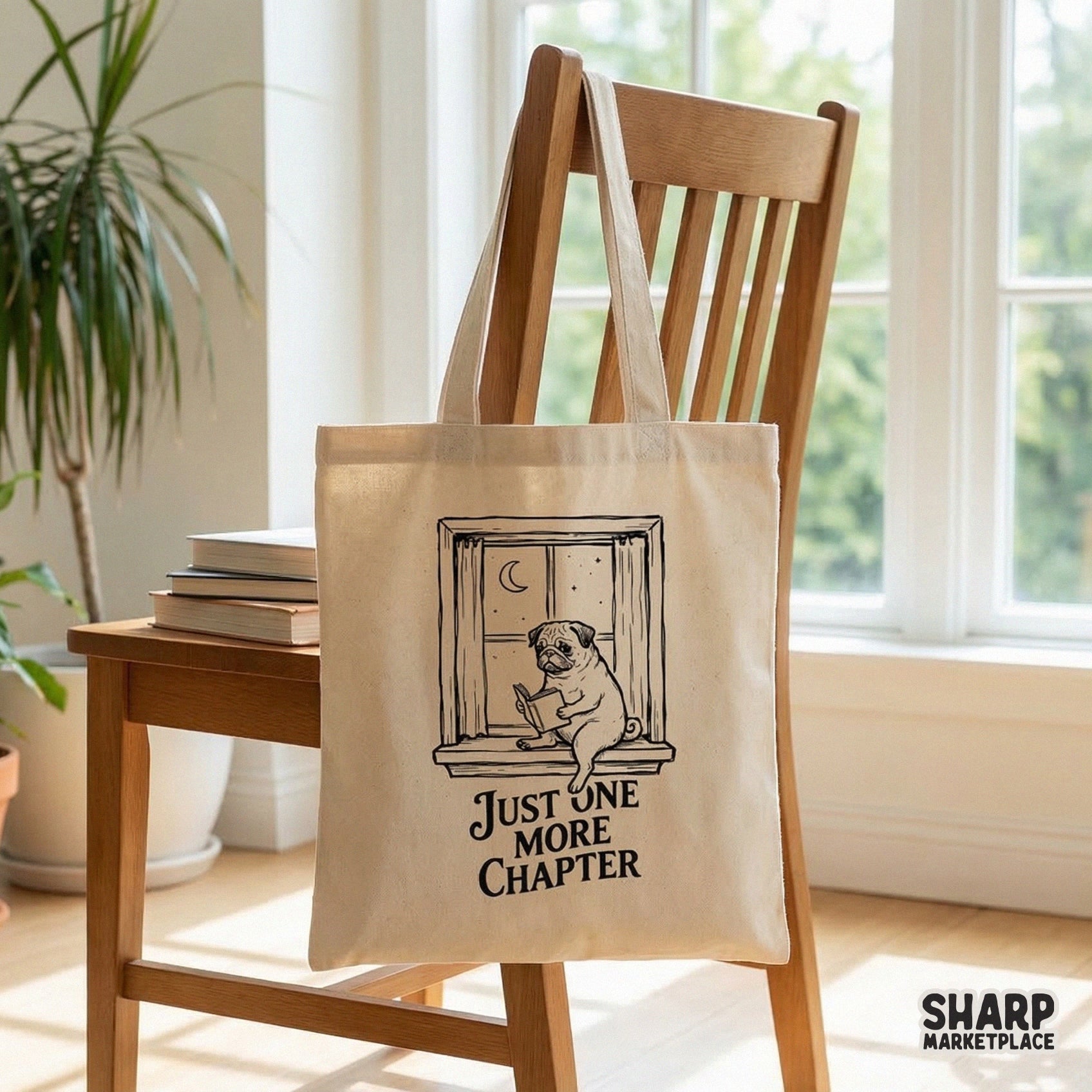 Cozy book lover graphic with a pug reading in a window at night, featuring the text Just One More Chapter for use on shirts, mugs, and tote bags.