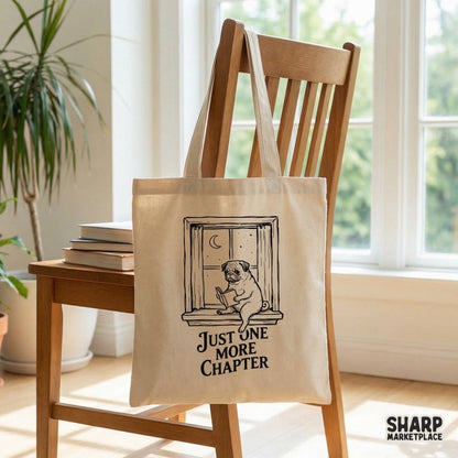 Cozy book lover graphic with a pug reading in a window at night, featuring the text Just One More Chapter for use on shirts, mugs, and tote bags.