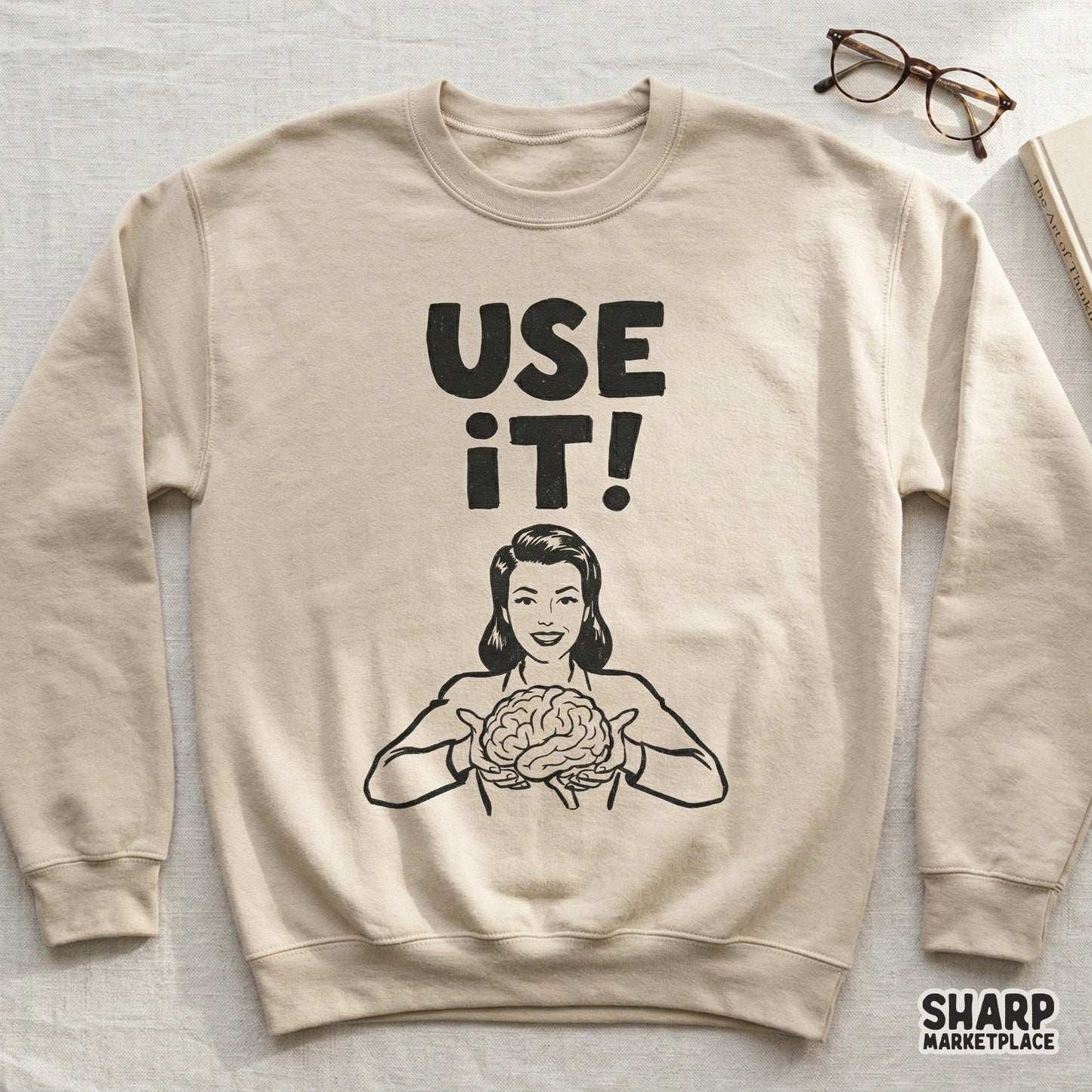Digital illustration of a mid-century woman holding a human brain with bold distressed text reading Use It! perfect for custom apparel and stickers.