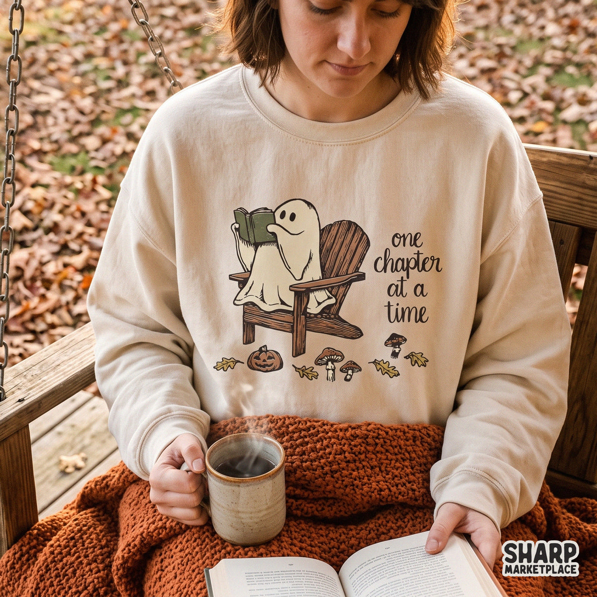 Cute reading ghost holding a book fall graphic clipart for bookworms and spooky season DTG shirt designs