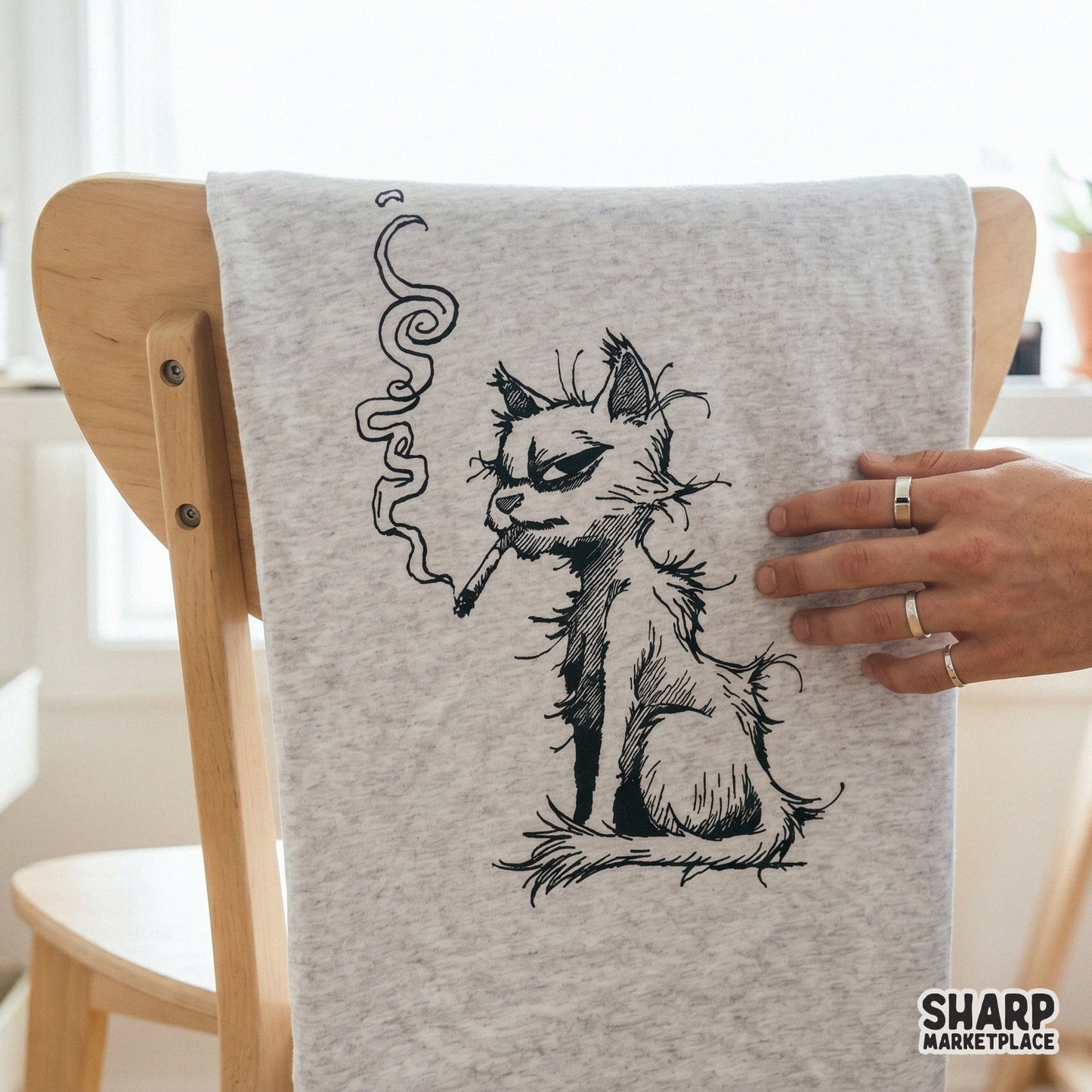 Scruffy cat smoking a cigarette in a retro vintage graphic design for funny animal meme shirts