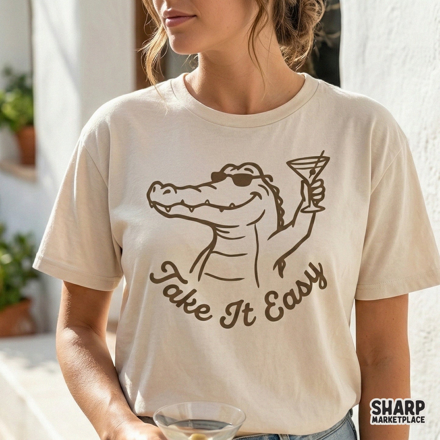 Digital sublimation design featuring a relaxed alligator with a martini glass and the phrase Take It Easy, perfect for summer apparel or stickers.