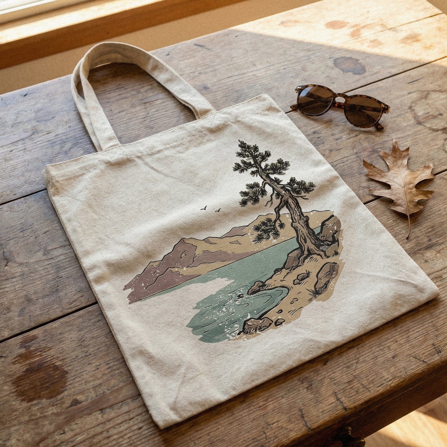 Hand-drawn mountain lake landscape design with a rustic pine tree, presented as a digital graphic for sublimation, stickers, or custom DIY apparel projects.