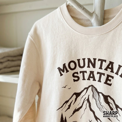 Vintage-style mountain landscape digital art with the phrase Breathe Wild, suitable for hunting gear, camping apparel, and rustic wall art prints.