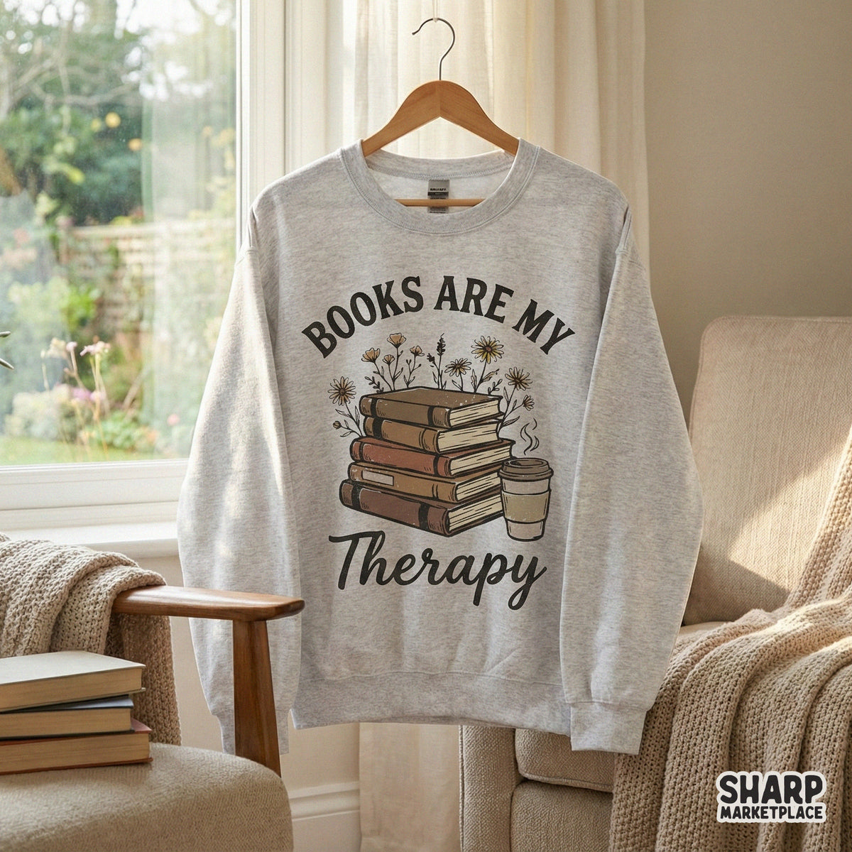 Sublimation design featuring a stack of five hardback books, a coffee cup, and wildflowers with arched serif and script text for reading-themed gear.