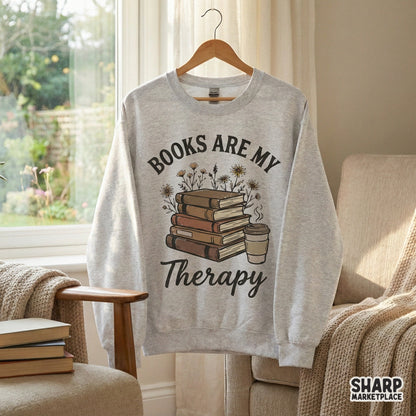 Sublimation design featuring a stack of five hardback books, a coffee cup, and wildflowers with arched serif and script text for reading-themed gear.