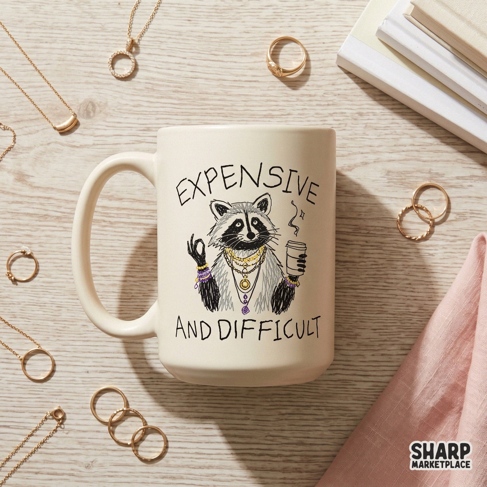 Digital sublimation graphic of a stylish raccoon making an okay hand gesture, adorned in layered gold necklaces and bracelets with a steaming coffee cup.