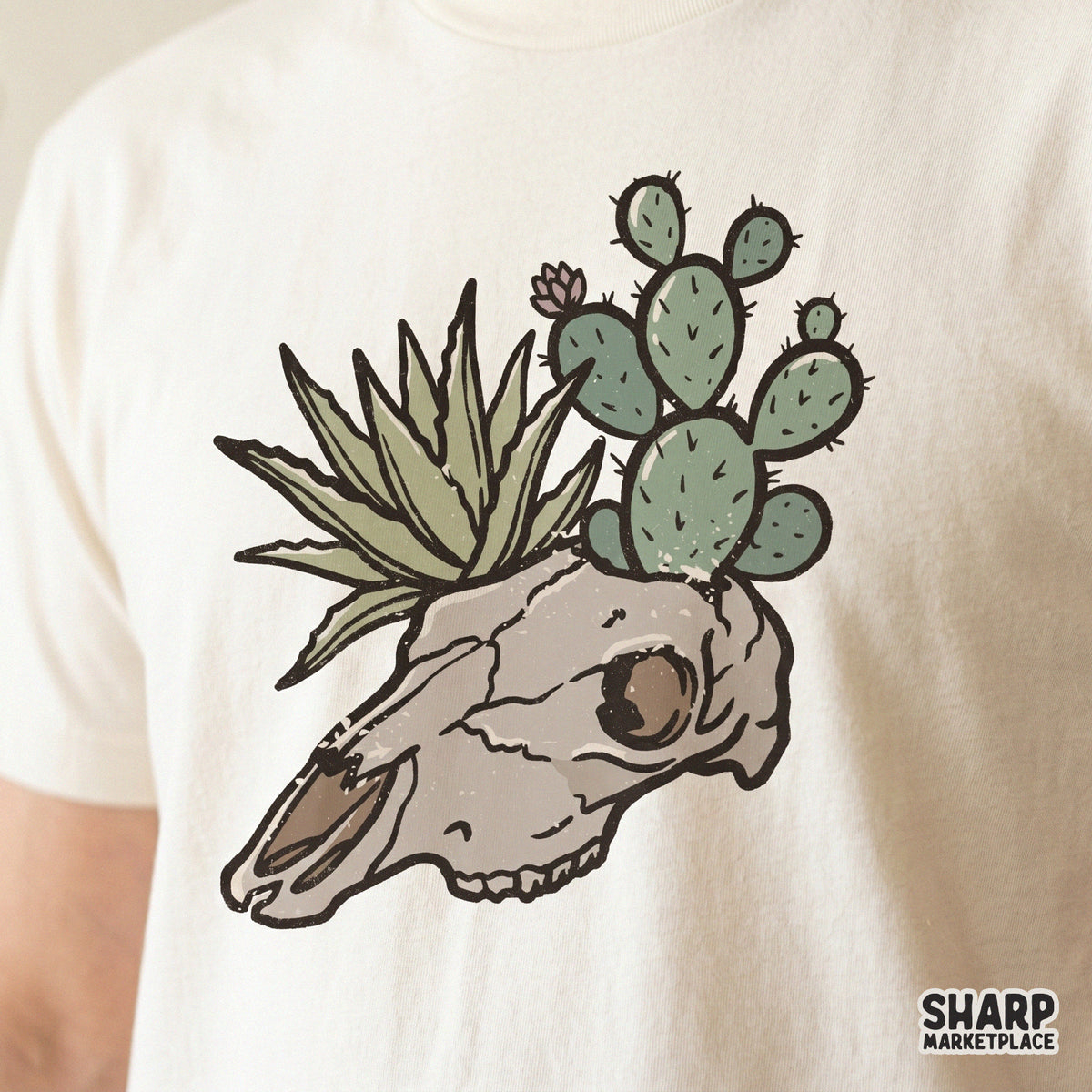 Detailed hand-drawn desert skull illustration with a cactus and succulent, ideal for western-themed t-shirts, stickers, tumblers, and wall art projects.