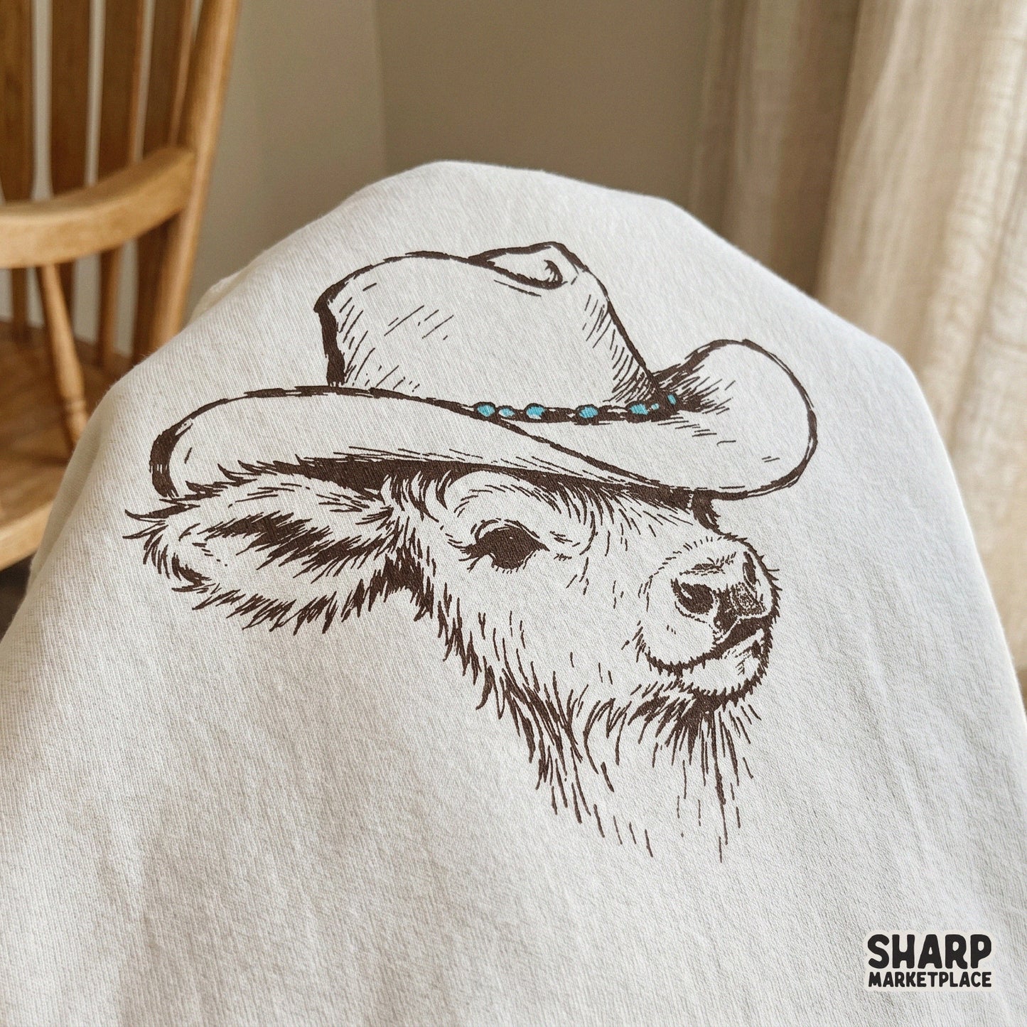 Rustic western-style digital graphic of a baby highland cow in a cowboy hat, ideal for creating custom ranch-themed shirts, stickers, and tumblers.