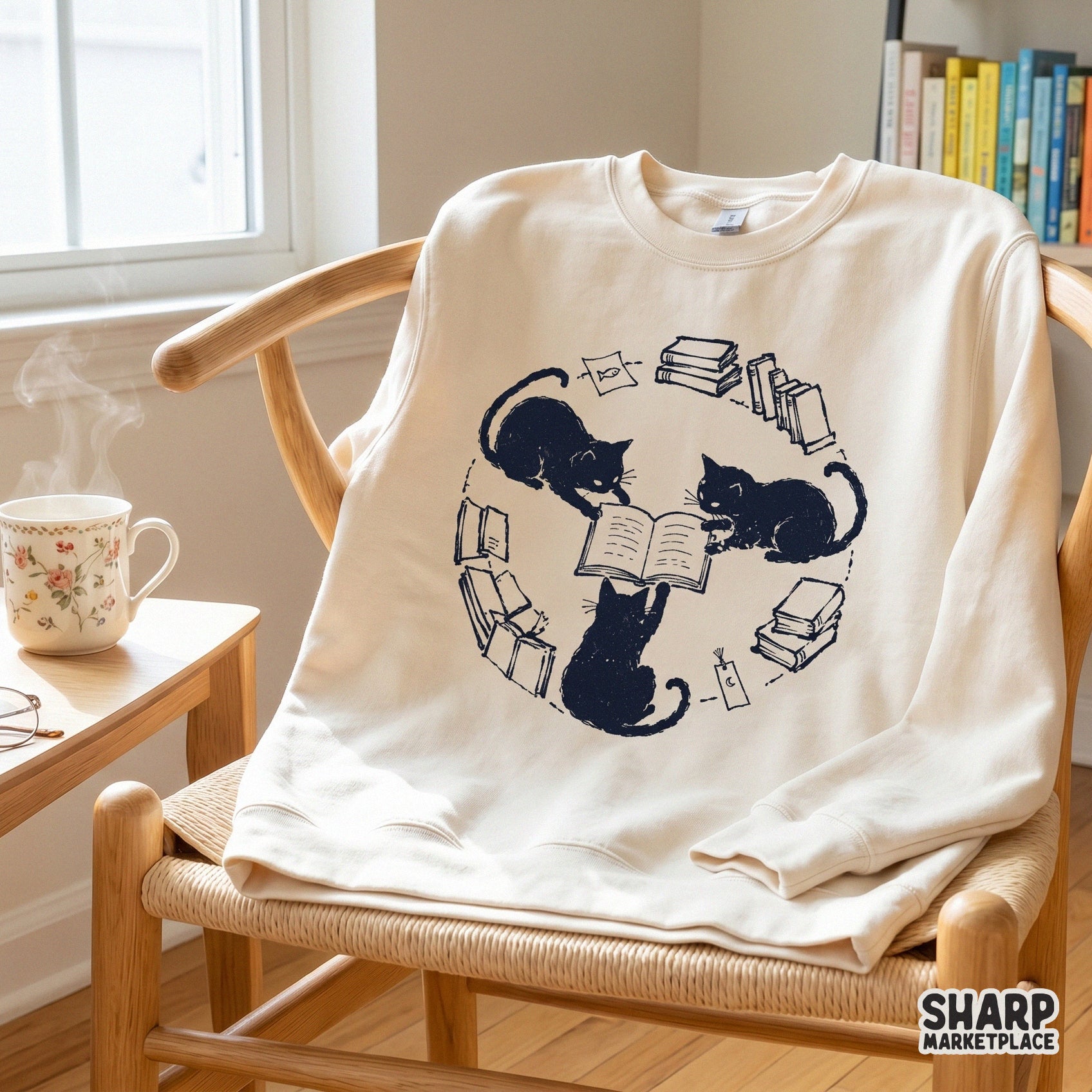 Monochromatic digital design of three ink-blot style cats reading together, surrounded by books and charms, ideal for custom tote bags and shirts.