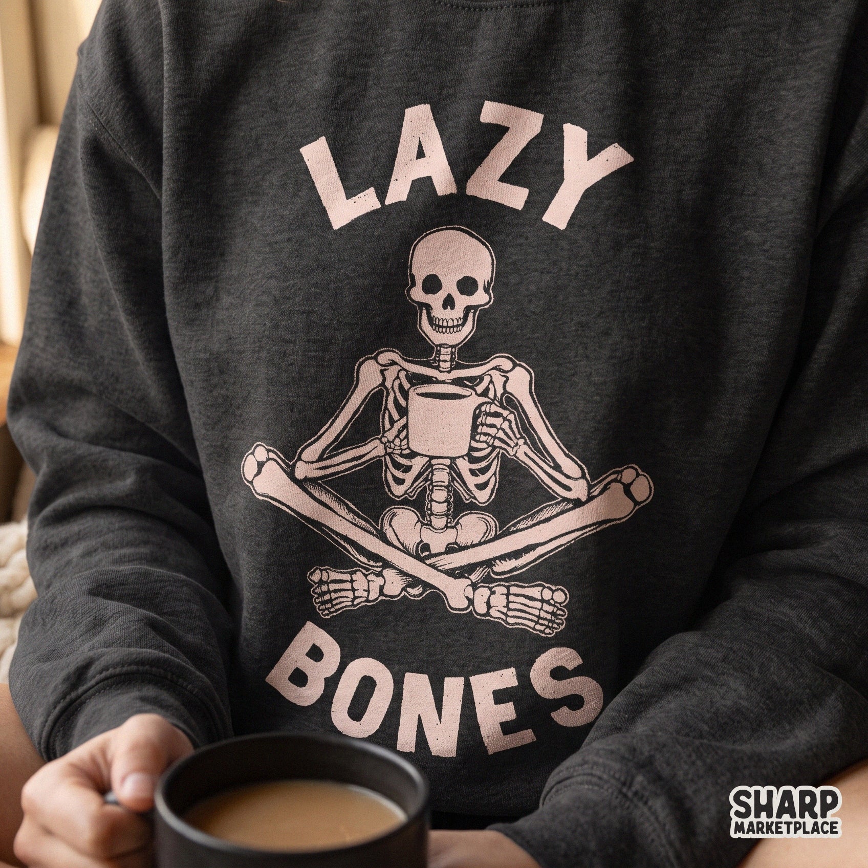 Lazy bones skeleton drinking coffee with pink skull design for trendy retro spooky season Halloween apparel and crafts