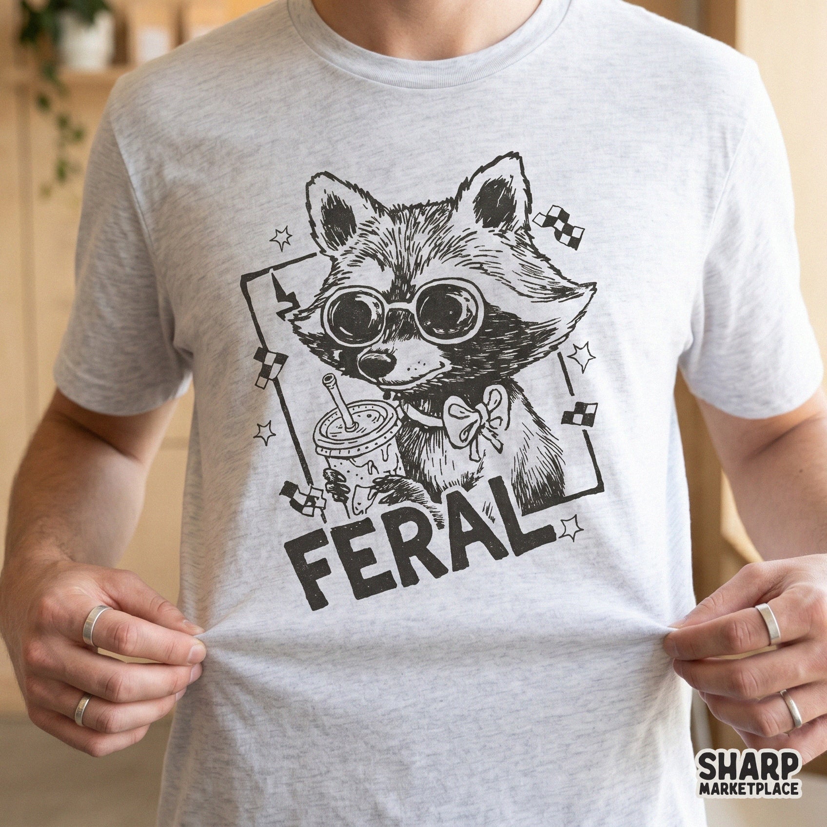 Digital sublimation design of a sarcastic raccoon with a snack cup, featuring a distressed ink style, stars, and lightning bolt for custom t-shirts.