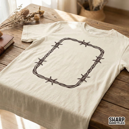 A rustic barbed wire rectangular border design printed on a light-colored t-shirt, perfect for western-inspired apparel.