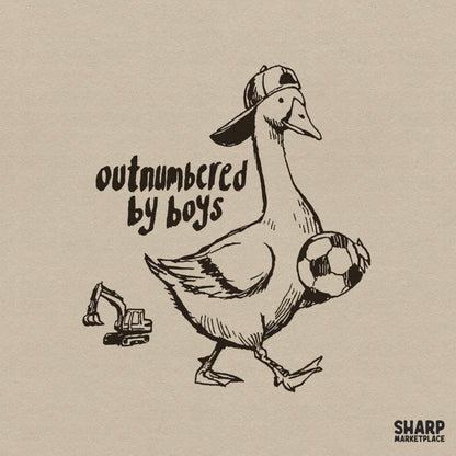 Hand-drawn vintage style illustration of a goose wearing a backward baseball cap, holding a soccer ball with a small excavator, text says Outnumbered By Boys.