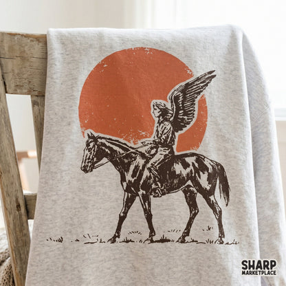 Detailed silhouette graphic of an angelic rider on a horse, designed for DTF printing, stickers, and creative western-inspired DIY craft projects.