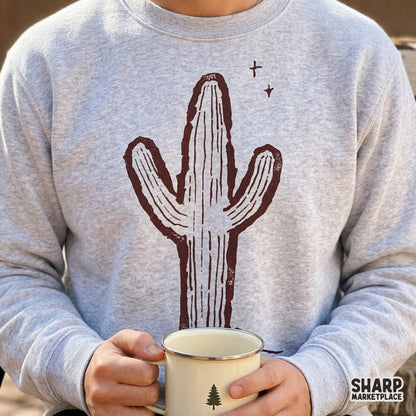 Rustic maroon saguaro cactus silhouette with desert rock accents, designed as a versatile transparent PNG for trendy western graphic tees and crafts.