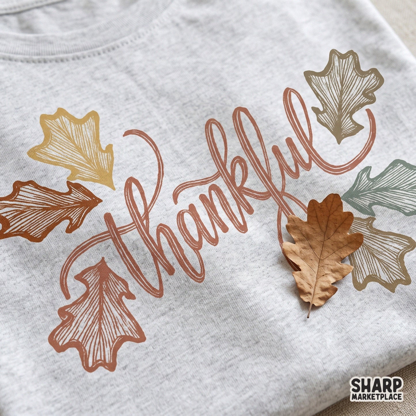 Thankful elegant lettering with autumn leaves for Thanksgiving sublimation on fall apparel and cozy season decor