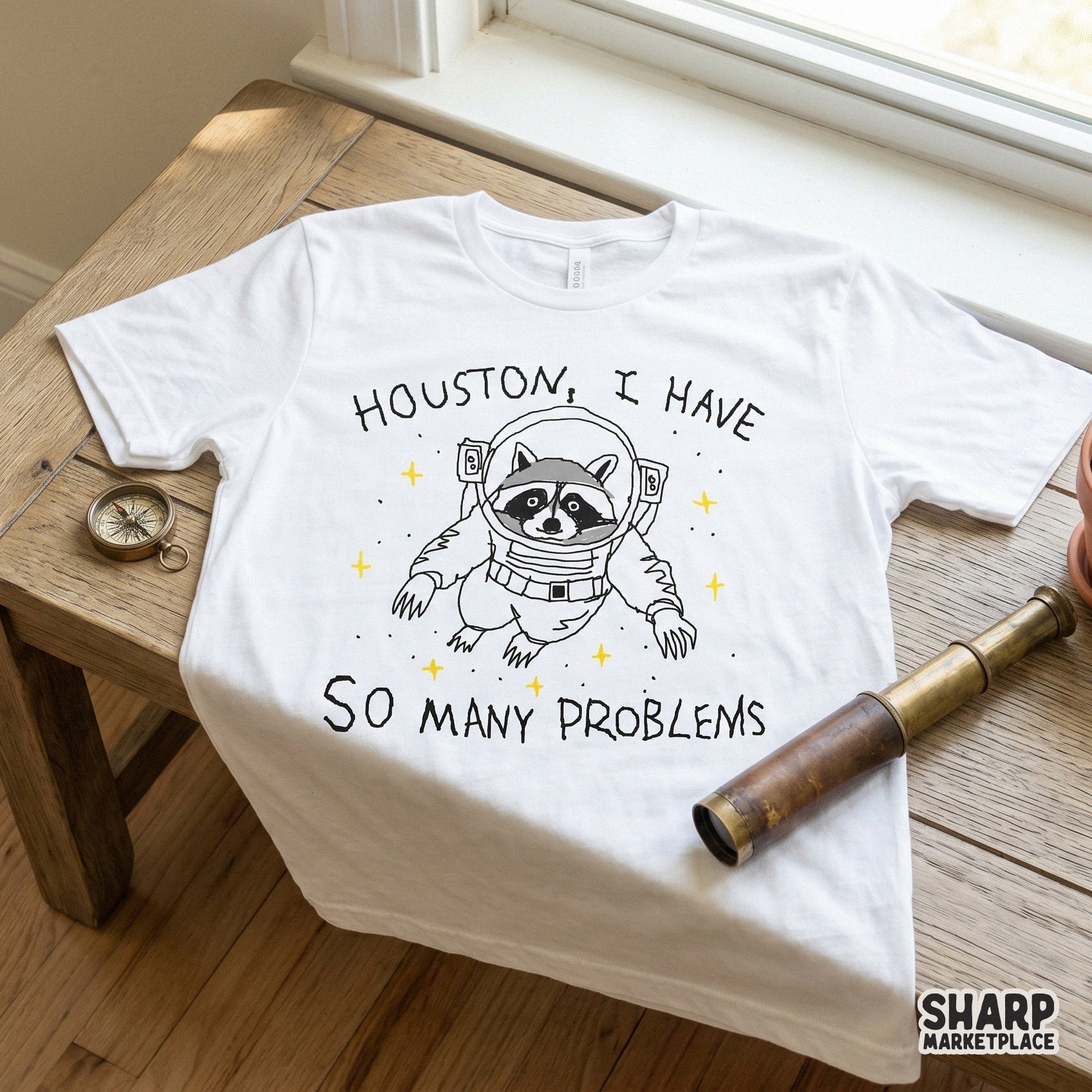 Whimsical astronaut raccoon design with the quote Houston I Have So Many Problems perfect for sarcastic t-shirts and printable craft projects.