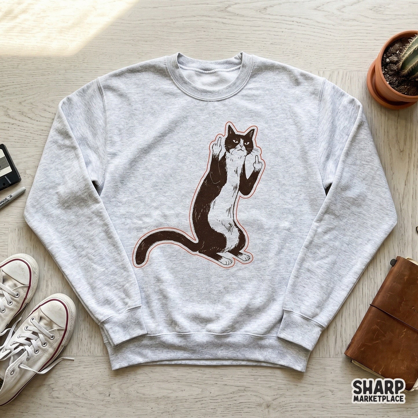 Sarcastic tuxedo cat graphic with a vintage woodcut aesthetic, featuring a grumpy feline flipping middle claws for custom stickers and shirt designs.