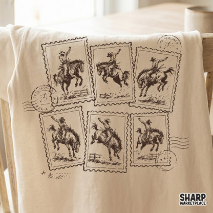 Rustic western illustration on a t-shirt mockup, showing six postage stamps with rodeo bronco riders and weathered postal cancellation marks.