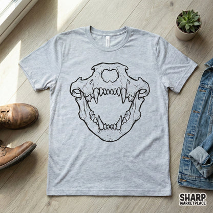 Detailed black and white saber-toothed predator skull illustration printed on the front of a heather gray t-shirt for apparel sublimation.