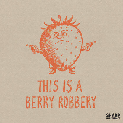 Grumpy strawberry outlaw holding two revolvers with the distressed text This Is A Berry Robbery in a retro orange sketch style for sublimation.