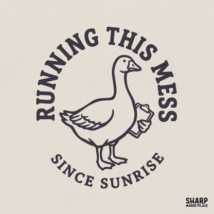 A navy blue line art illustration of a goose holding a clipboard, surrounded by the text Running This Mess Since Sunrise in a circular vintage style.