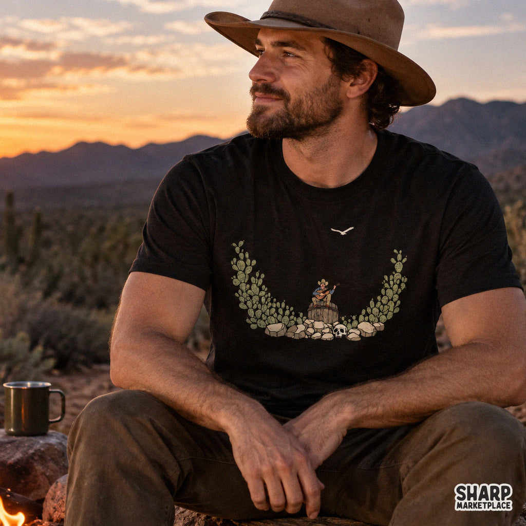 Retro cowboy playing guitar in a desert with cactus art, western png for country music graphic tees and sublimation