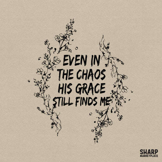 Hand-drawn floral frame surrounding the inspirational text Even In The Chaos His Grace Still Finds Me in a rustic black textured font style.