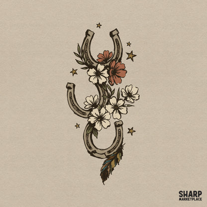 Western horseshoe illustration with wildflower charms, a feather trail, and stars in a rustic, vintage cowgirl style for sublimation and apparel.