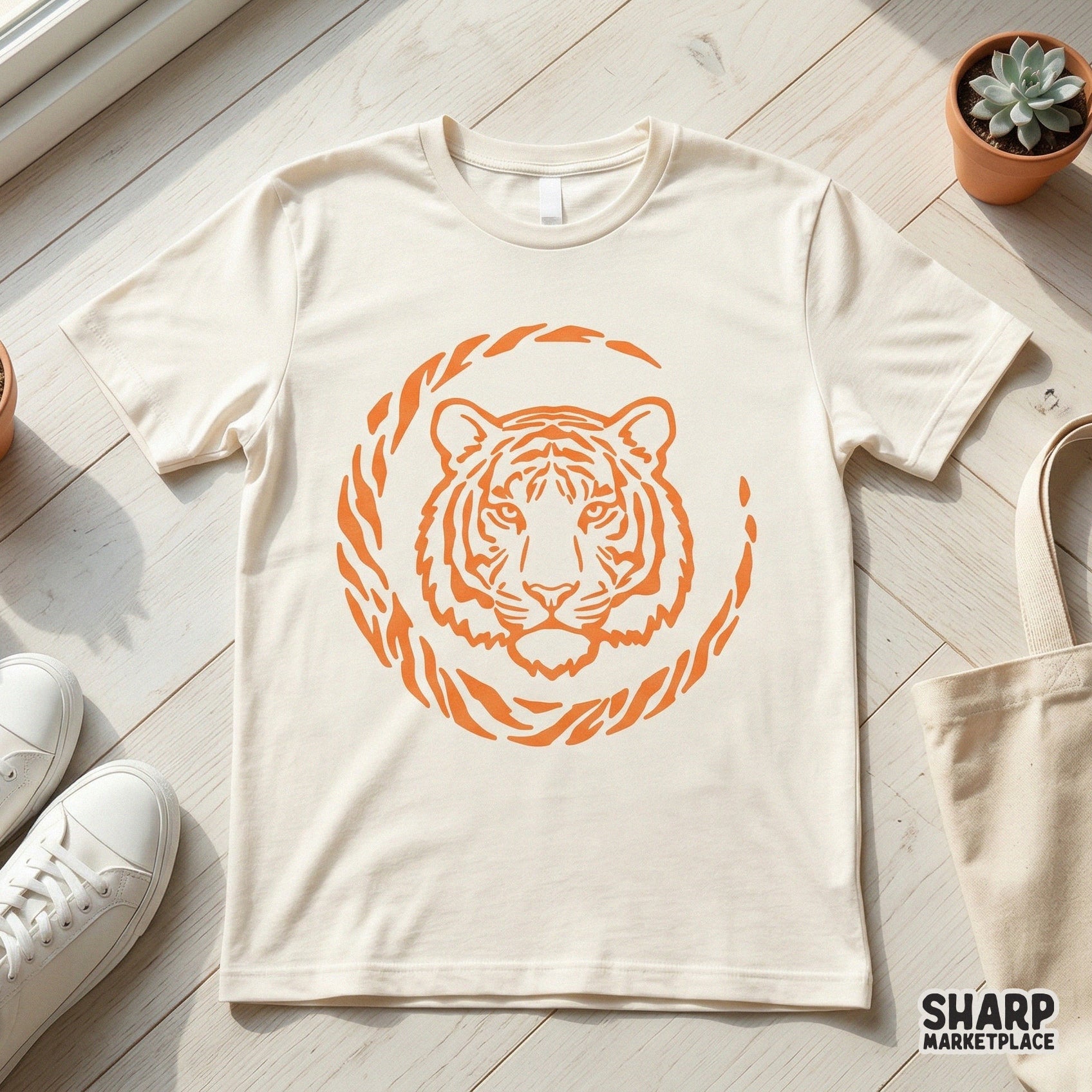 Minimalist orange tiger face line art inside a circular striped frame, ideal for creating custom apparel, tumblers, and nature-themed wall art.