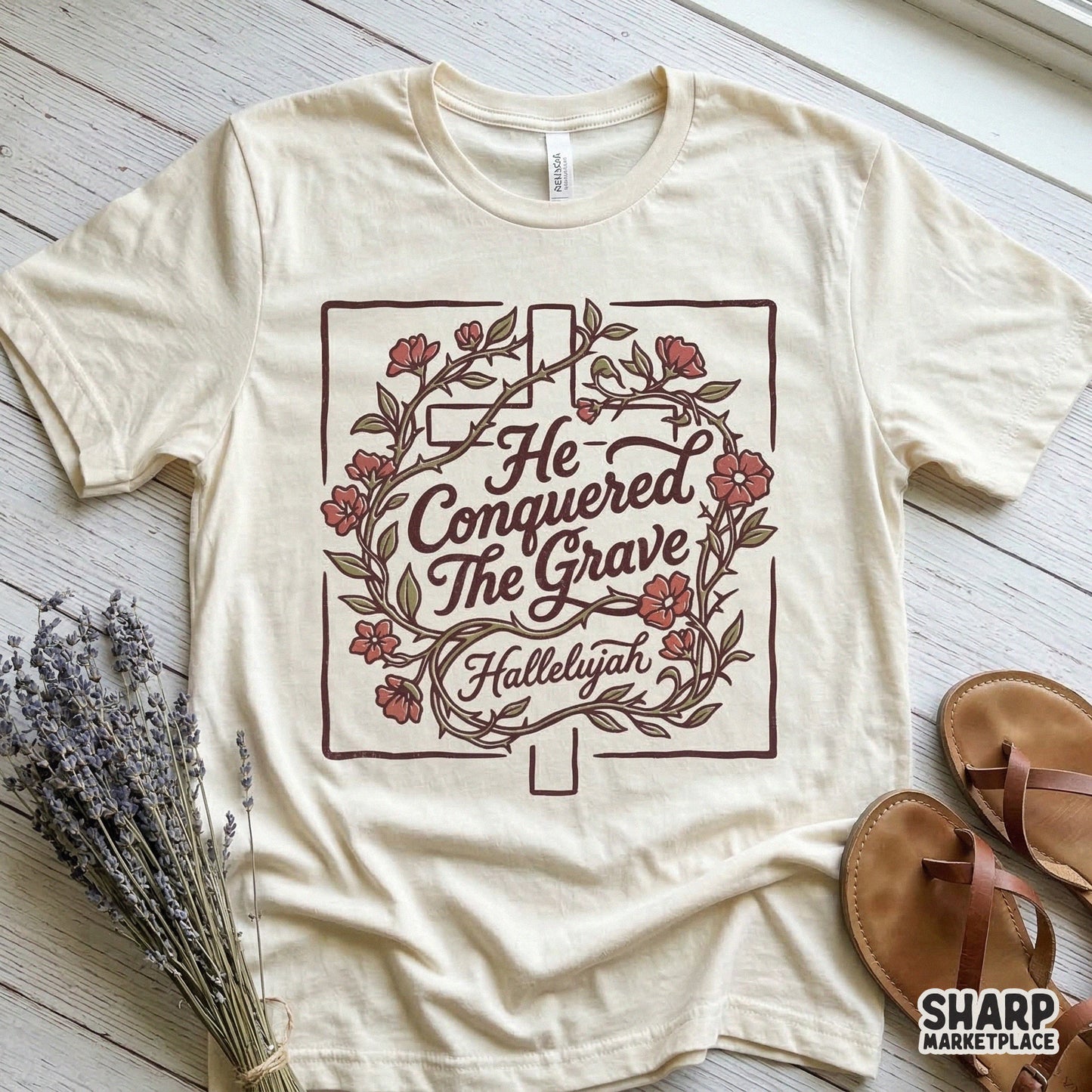 Vintage style religious PNG design with a hand-drawn cross, floral elements, and the inspirational text He Conquered The Grave Hallelujah.
